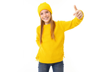 Red-haired European girl shows a class on a white background
