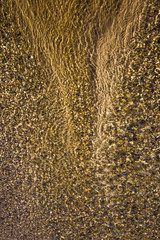 the structure of water in shades of sunlight, the manifestation of texture in the form of abstraction