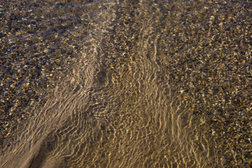 the structure of water in shades of sunlight, the manifestation of texture in the form of...