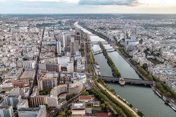Obraz premium Aerial panoramic view of Paris roofs and Seine river from Eiffel Tower. Paris, France.
