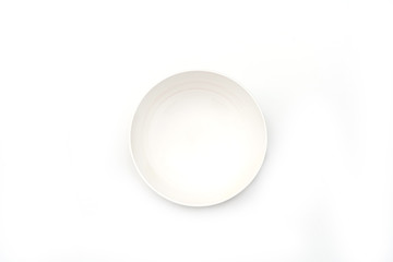 Fototapeta premium Empty white ceramic round plate isolated on white background..