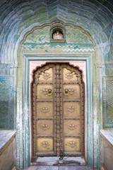 gate door in pink city at City Palace of Jaipur, India