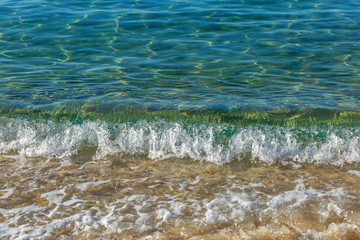 Transparent turquoise surface of the sea. Relax and calm. Background. Space for text.