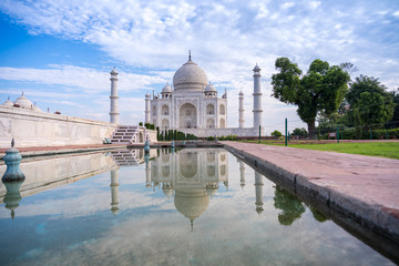 Taj Mahal monument reflecting in water of the pool, Agra, India