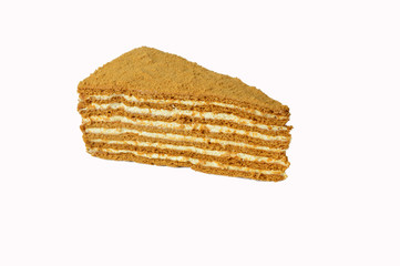 a piece of honey cake isolated on white background