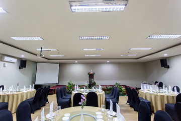 Meeting or gathering room with round table facility set