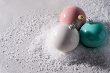 color christmas balls on a snow background