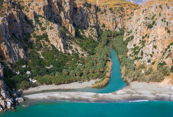 Panorama of Preveli beach at Libyan sea, river and palm forest, southern Crete , Greece