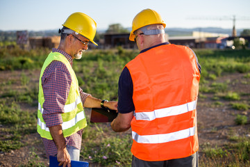 Engineers,oil workers at industrial facility