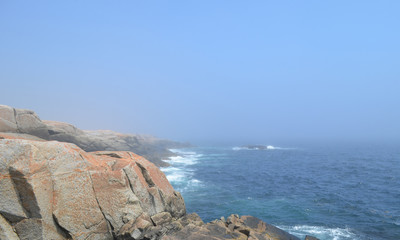 Summer in Nova Scotia: Rocky Coastline at Peggy's Cove Disappears into the Fog