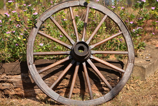 wooden wheel with iron rim and flowers