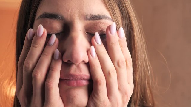 girl whimpers and wipes tears with her hand 4k