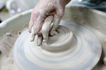 Potter teaches kid pottery