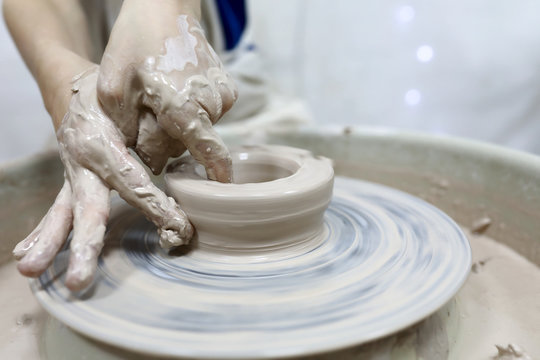 Child Hands Making In Clay