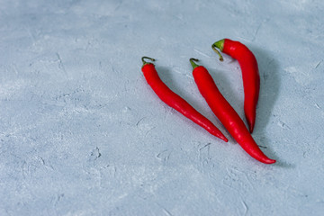 red hot chili peppers on a gray stone background