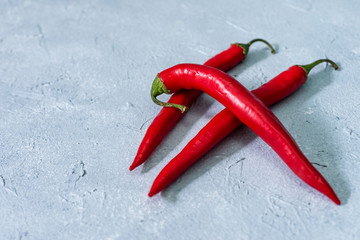 red hot chili peppers on a gray stone background