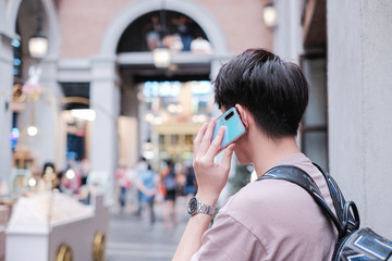 Young man on his phone in the city