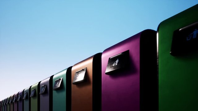 A colored row of iron garbage bins against a clear blue sky. Waste sorting and saving the environment. 4k