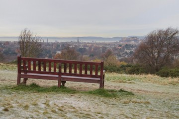 Park bench with views across the city skyline 