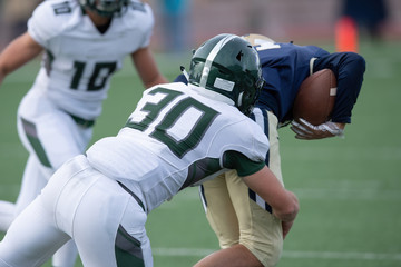Fototapeta premium Action photos of high school football players making amazing plays during a football game