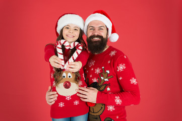 Christmas is love. Little daughter show love heart to father. Bearded man and small child on xmas. Share love and care. Family values. Happy family celebrate new year and Christmas. Love and trust