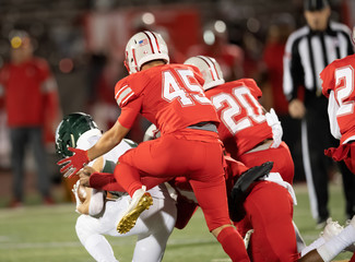 Action photos of high school football players making amazing plays during a football game