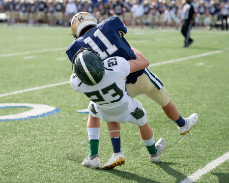 Action photos of high school football players making amazing plays during a football game
