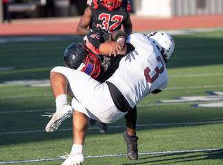 Fototapeta premium Action photos of high school football players making amazing plays during a football game