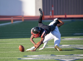 Action photos of high school football players making amazing plays during a football game