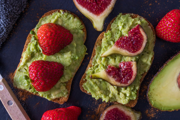 avocado or guacamole toast with berries