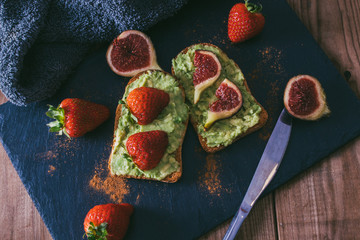 avocado or guacamole toast with berries