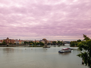 Obraz premium View from Boat to Old Town of East Europe Prague City with stunning sky sunset