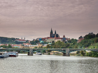 Obraz premium View from Boat to Old Town of East Europe Prague City with stunning sky sunset