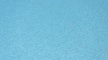 Delicate winter pattern. Frost painted the glass. New year, Christmas. Festive background.