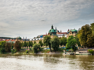 Obraz premium View from Boat to Old Town of East Europe Prague City with stunning sky sunset