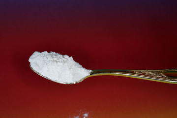 Flour with macro lens photographed against colorful gradient in studio