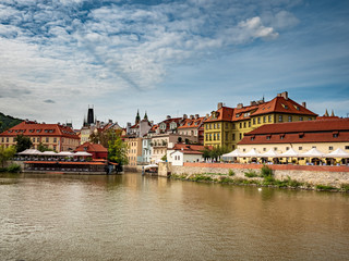 Fototapeta na wymiar View from Boat to Old Town of East Europe Prague City with stunning sky sunset