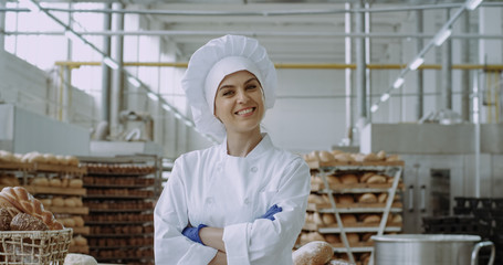Commercial face of a amazing woman baker looking straight to the camera