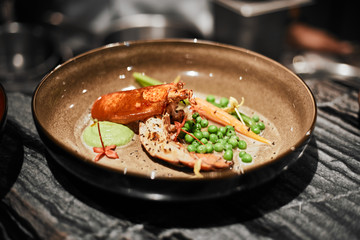 Beautiful and tasty food on a plate, exquisite dish, creative restaurant meal concept, selective focus.