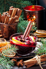 Mulled wine with citrus and  cranberry  in  glass  mug