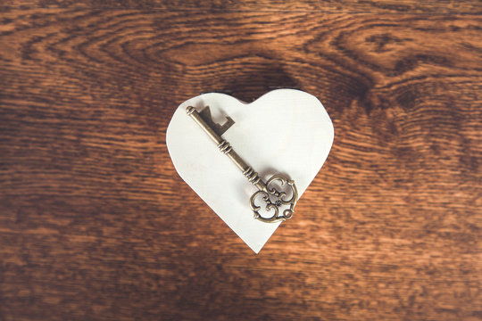 key on wooden heart