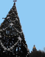 Christmas tree. Garland and star decorations. New Years is soon. View of St. Isaac's Cathedral....