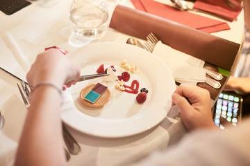 Chef decorate dessert. Decoration of flowers and fruit, Selective focus.