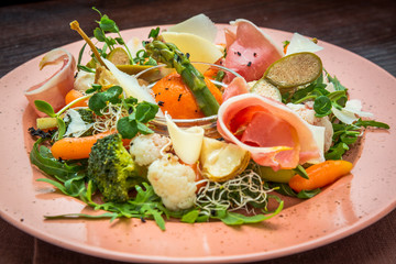 Fresh salad from vegetables, cheese and ham