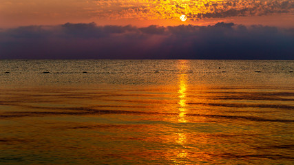 Beautiful mysterious marine landscape at sunset. Dramatic evening seascape. Panoramic banner.