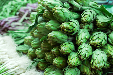 Big ripe organic artichokes for sale at local market..