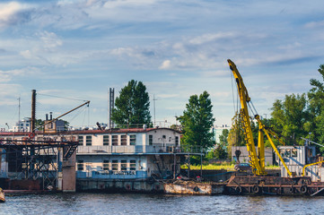 Fototapeta na wymiar Floating repair station and cranes for river vessels