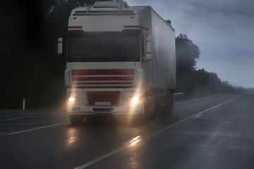 truck moving in rain and fog