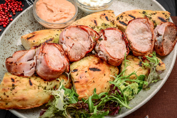 Grilled meat skewers on a wooden background