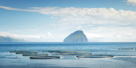 Panoramical view of fish farm near Sandavagur village on Vagar island with Koltur island on...